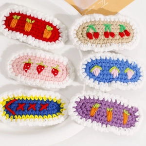 Handmade crochet knit hair clips set featuring cherry, flower, and strawberry patterns