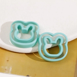 Macro view of mint green hollow bunny resin charms for DIY earring and hair accessory