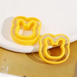 Detail of bunny resin DIY accessories on a white marble tray with natural soft lighting