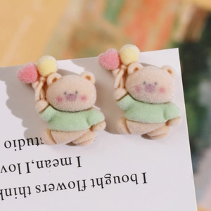 Close-up of cute flocked bear resin patches with soft velvet texture for DIY accessories