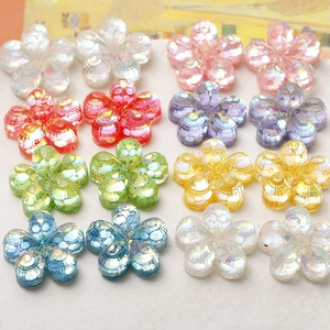 Macro view of colorful resin flower beads with holographic sequins for DIY jewelry