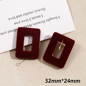 Detail of burgundy flocked rectangular earrings with 32mm by 24mm size measurements