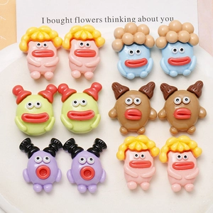 Macro detail of quirky resin mushroom characters in colorful DIY accessory set