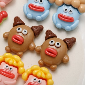 Detailed view of colorful resin cartoon mushroom monsters with big eyes and red lips for DIY