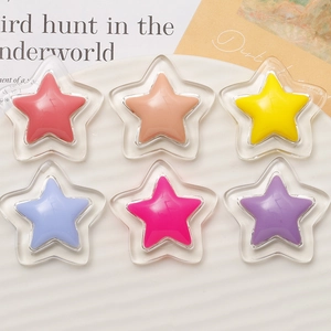 Close-up of double-layered pentagram resin charms in assorted macaron colors