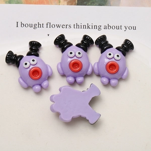 Detail of purple cartoon resin charms with double ponytails and a smooth flat back