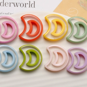 Detailed view of colorful crescent moon resin charms for DIY jewelry making accessories