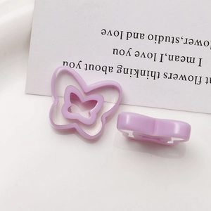 Detailed view of light purple hollow butterfly resin charms for DIY jewelry earrings