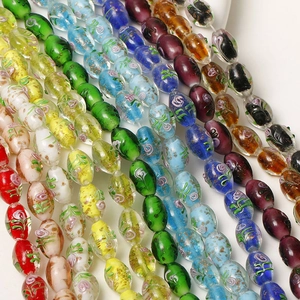Handmade oval glass beads with gold foil and flower patterns for DIY jewelry making