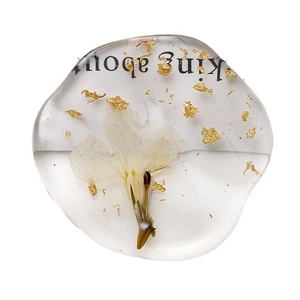 Transparent resin oval charm with real white dried flower, gold foil and text inlay