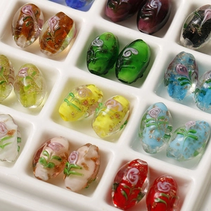 Oval gold foil lampwork glass beads with floral patterns for DIY jewelry making