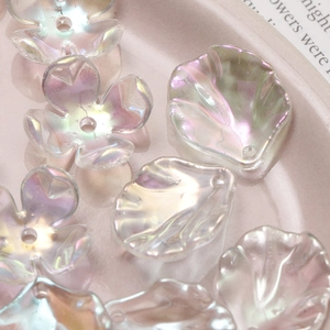 Macro view of iridescent gradient camellia flower beads for DIY jewelry making