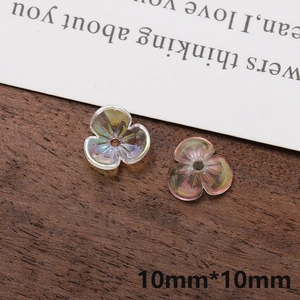 Macro detail of 10mm iridescent flower acrylic beads for DIY jewelry and hair accessories