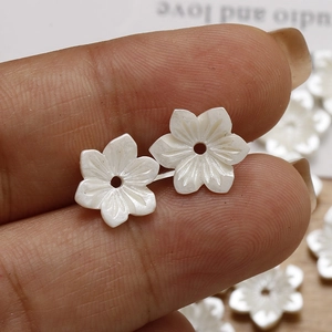 White resin flower beads with iridescent finish and center hole for DIY jewelry making