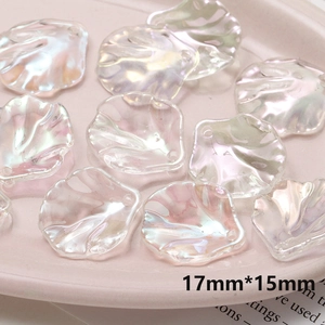 Macro view of 17mm iridescent camellia flower petal charms for DIY jewelry making