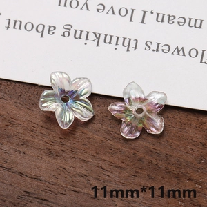 Macro view of 11mm iridescent pearlized five-petal acrylic flower charms for DIY jewelry