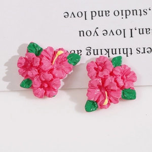 Pair of glossy pink flower resin charms with yellow pistils and green leaves for DIY hair clips