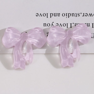 Translucent light purple resin bow charms with pearlescent texture for DIY accessories
