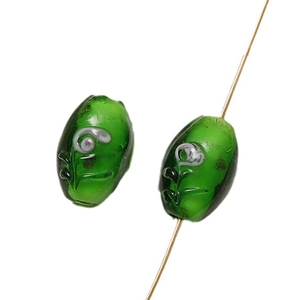 Oval green glazed glass beads with handcrafted floral patterns for DIY jewelry making