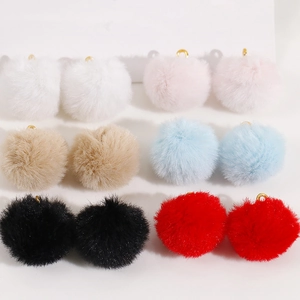 Detail of 20mm soft colorful faux fur pompom charms with gold metal loops for DIY jewelry