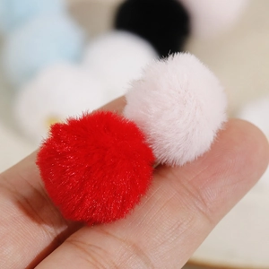Detail of 20mm soft plush colorful pom-poms for DIY jewelry and accessories making