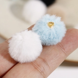 Detailed view of 20mm soft plush faux fur charms with gold metal rings for DIY earrings