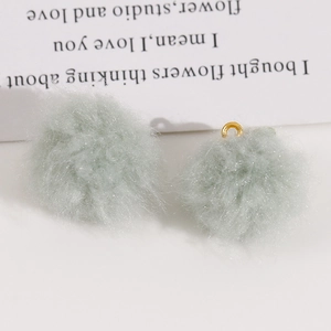 Pair of fluffy mint green faux fur pom pom pendants with gold rings for DIY jewelry making
