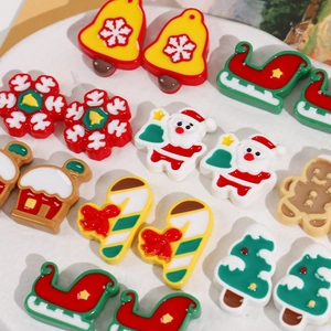 Assorted Christmas resin flatback charms including Santa, snowflakes and gingerbread man