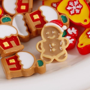 Christmas DIY resin charms with gingerbread man, red house and yellow bell designs