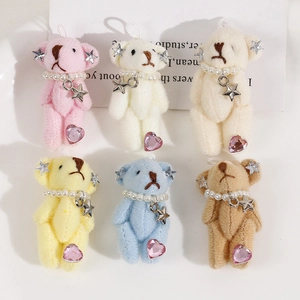 Set of mini plush bear keychains with pearls and star charms in six pastel colors