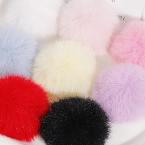 Macro shot of colorful 50mm faux rabbit fur pompoms for DIY jewelry and hair accessories