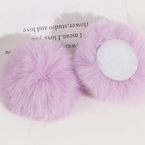 Detailed close-up of 50mm light purple faux rabbit fur pom-poms with felt base for DIY crafts