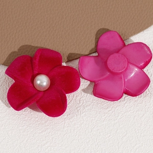 Detail of DIY flocking flower charms with pearls showing front texture and back base