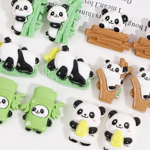 Detailed view of various cute panda resin flatback charms for DIY hair accessories and crafts