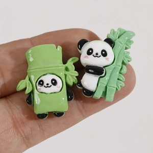 Detailed view of cute resin panda and green bamboo charms for DIY jewelry making