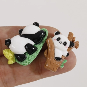 Detailed macro view of cute 3D panda resin charms for DIY hair clips and jewelry making