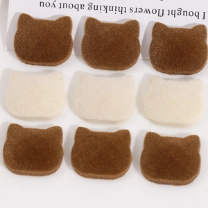Detailed view of flocked cat ear resin patches for DIY jewelry and hair accessories