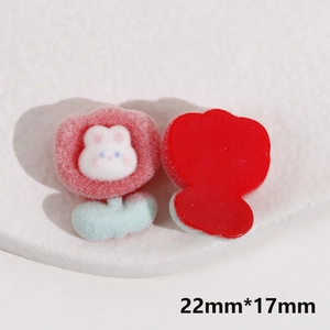 Detailed view of pink flocked rabbit flower resin patch with dimensions 22mm by 17mm