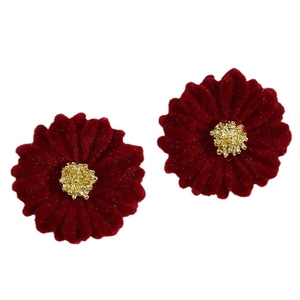 Elegant wine red velvet daisy earrings with gold stamen detail on a white background