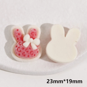 Macro view of 23mm flocking rabbit DIY charms with red polka dots and white bow
