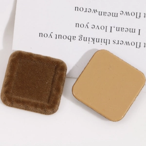 Detail of square DIY resin charms with deep brown flocking and smooth back surface