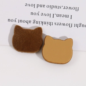 Detailed view of flocked cat-head resin charms in dark brown for DIY crafts and jewelry
