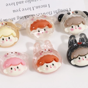 Close-up of translucent resin cartoon character charms for DIY cream glue crafts