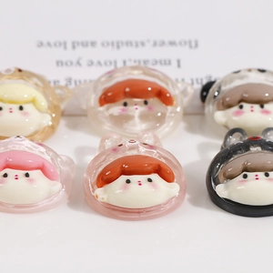Macro shot of cute cartoon resin girl charms with transparent animal ears for DIY crafts