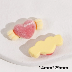 Detail of 14mm heart-shaped pink flocked resin charms with Sweet text for DIY crafts