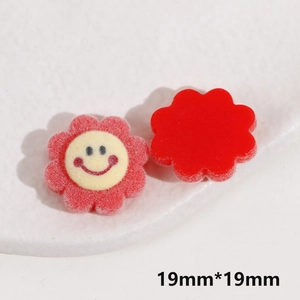 Macro view of 19mm red flocked flower resin charms with smile detail for DIY jewelry