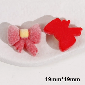 Detail showing 19mm red and pink flocked bow resin charms for DIY jewelry making