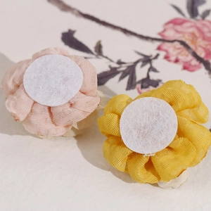 Pastel fabric mesh rose flower hair accessories in pink and yellow with soft gauze texture