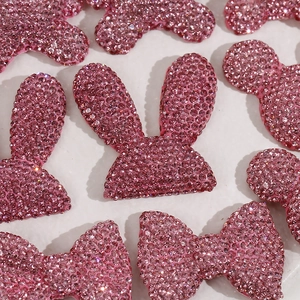 Sparkly pink resin charms with glitter rhinestones in rabbit and bow shapes for DIY hairpins
