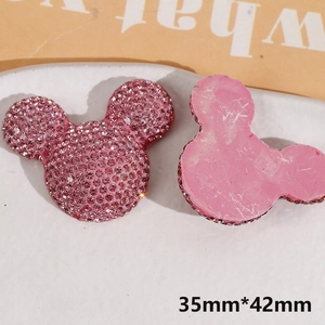 Macro view showing both sides of a pink rhinestone Mickey Mouse DIY charm, 35x42mm size